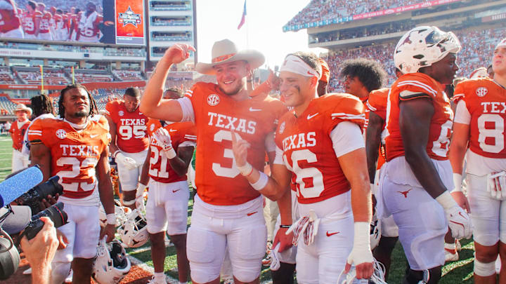 Aug 31, 2024; Austin, Texas, USA; Texas Longhorns quarterback Quinn Ewers (3) and defensive back Michael Taaffe (16) pose for a picture after defeating the Colorado State Rams at Darrell K Royal-Texas Memorial Stadium. Mandatory Credit: Aaron Meullion-Imagn Images