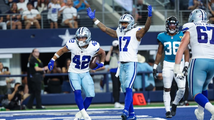 Aug 12, 2023; Arlington, Texas, USA;  Dallas Cowboys running back Deuce Vaughn (42) scores a touchdown  during the second half against the Jacksonville Jaguars at AT&T Stadium.