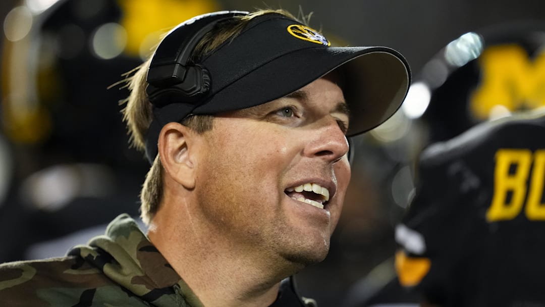 Nov 9, 2024; Columbia, Missouri, USA; Missouri Tigers head coach Eliah Drinkwitz talks to players during a timeout in the second half against the Oklahoma Sooners at Faurot Field at Memorial Stadium. Mandatory Credit: Jay Biggerstaff-Imagn Images