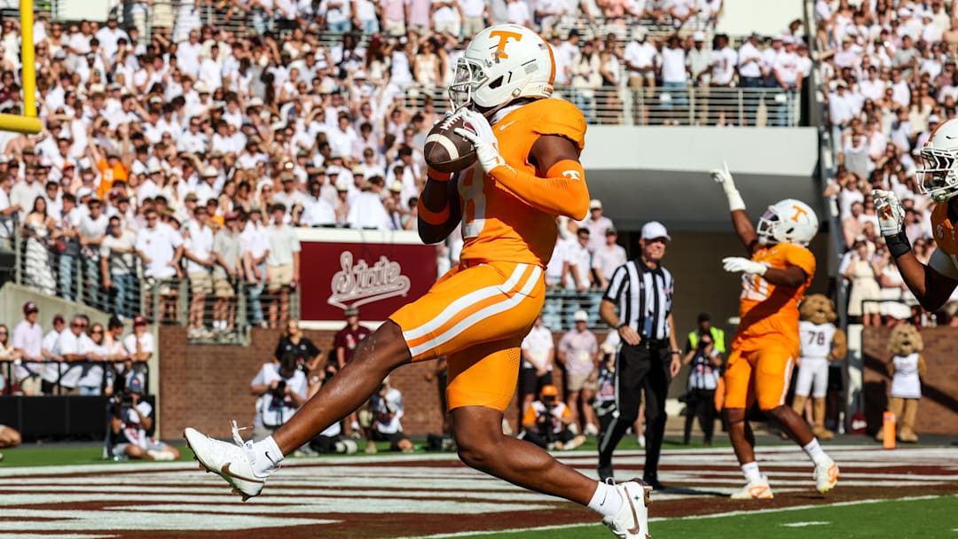 Sep 27, 2025; Starkville, Mississippi, USA; Tennessee Volunteers defensive back Colton Hood (8) scores a touchdown after an interception against the Mississippi State Bulldogs during the first half at Davis Wade Stadium at Scott Field. Mandatory Credit: Wesley Hale-Imagn Images