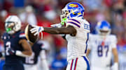 Nov 8, 2025; Tucson, Arizona, USA; Kansas Jayhawks wide receiver Emmanuel Henderson Jr. (1) celebrates a first down against the Arizona Wildcats in the second half at Arizona Stadium. Mandatory Credit: Mark J. Rebilas-Imagn Images