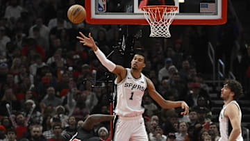 Dec 21, 2023; Chicago, Illinois, USA;  San Antonio Spurs center Victor Wembanyama (1) defends against Chicago Bulls center Andre Drummond (3) during the second half at the United Center. Mandatory Credit: Matt Marton-Imagn Images