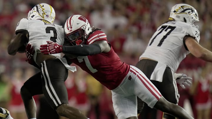 Wisconsin linebacker Jaheim Thomas (7) stops Western Michigan running back Jaden Nixon (3) short of a first down during the first quarter of their game Friday, August 30, 2024 at Camp Randall Stadium in Madison, Wisconsin.