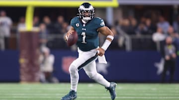 Dec 10, 2023; Arlington, Texas, USA; Philadelphia Eagles quarterback Jalen Hurts (1) rolls out in the game against the Dallas Cowboys at AT&T Stadium. Mandatory Credit: Tim Heitman-Imagn Images
