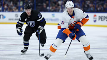 Feb 1, 2025; Tampa, Florida, USA;New York Islanders center Mathew Barzal (13) controls the puck against the Tampa Bay Lightning in the first period at Amalie Arena. Mandatory Credit: Nathan Ray Seebeck-Imagn Images