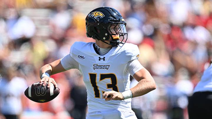 Sep 13, 2025; College Park, Maryland, USA;  Towson Tigers quarterback Andrew Indorf (13) passes in the first half against the Maryland Terrapins at SECU Stadium. Mandatory Credit: Jamie Sabau-Imagn Images