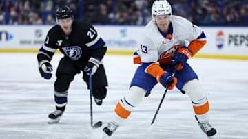 Feb 1, 2025; Tampa, Florida, USA;New York Islanders center Mathew Barzal (13) controls the puck against the Tampa Bay Lightning in the first period at Amalie Arena. Mandatory Credit: Nathan Ray Seebeck-Imagn Images