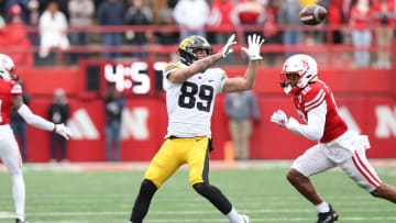 Nov 24, 2023; Lincoln, Nebraska, USA; Iowa Hawkeyes wide receiver Nico Ragaini (89) catches a pass in front of Nebraska Cornhuskers defensive back Omar Brown (12) at Memorial Stadium. Mandatory Credit: Reese Strickland-USA TODAY Sports