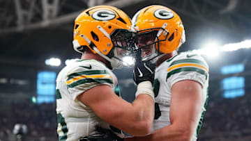 Oct 19, 2025; Glendale, Arizona, USA; Green Bay Packers tight end Tucker Kraft (85) celebrates a touchdown against the Arizona Cardinals with Green Bay Packers tight end Luke Musgrave (88) during the second half against the Arizona Cardinals at State Farm Stadium. Mandatory Credit: Joe Camporeale-Imagn Images