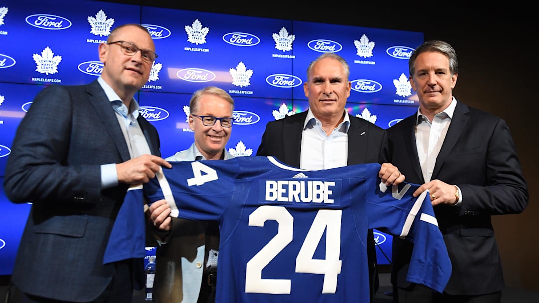 May 21, 2024; Toronto, Ontario, CANADA;  Newly appointed Toronto Maple Leafs head coach Craig Berube (second right) poses with a team jersey alongside (from left) general manager Brad Treliving, Maple Leaf Sport and Entertainment president Keith Pelley and club president Brendan Shanahan  at Ford Performance Centre. Mandatory Credit: Dan Hamilton-Imagn Images
