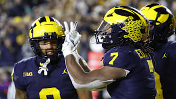 Nov 23, 2024; Ann Arbor, Michigan, USA;  Michigan Wolverines running back Donovan Edwards (7) celebrates after a touchdown against the Northwestern Wildcats in the second half at Michigan Stadium. Mandatory Credit: Rick Osentoski-Imagn Images