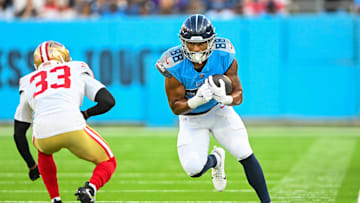 Aug 10, 2024; Nashville, Tennessee, USA;  Tennessee Titans tight end David Martin-Robinson (88) runs through San Francisco 49ers cornerback Rock Ya-Sin (33) during the first half at Nissan Stadium. Mandatory Credit: Steve Roberts-Imagn Images