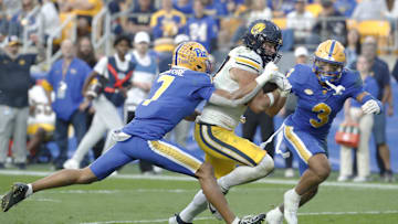 Oct 12, 2024; Pittsburgh, Pennsylvania, USA;  California Golden Bears tight end Jack Endries (87) runs for a touchdown as Pittsburgh Panthers defensive back Javon McIntyre (7) and defensive back Donovan McMillon (3) chase during the fourth quarter at Acrisure Stadium. Pittsburgh won 17-15. Mandatory Credit: Charles LeClaire-Imagn Images