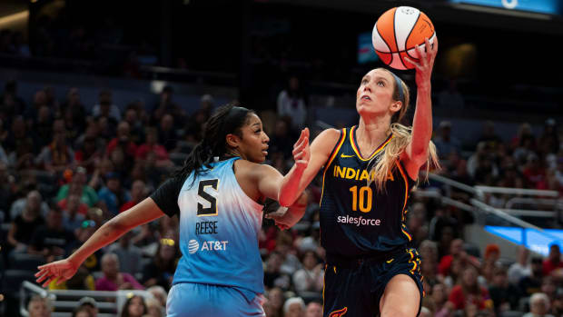 Indiana Fever guard Lexi Hull (10) attempts a layup while being guarded by Chicago Sky forward Angel Reese