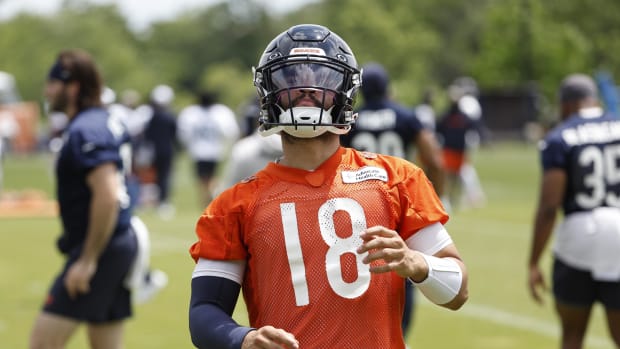 Chicago Bears quarterback Caleb Williams (18) warms up during the team's minicamp at Halas Hall.  