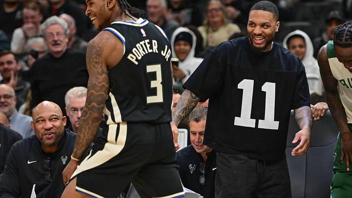 Milwaukee Bucks guard Damian Lillard (right) celebrates with guard Kevin Porter after a score in the fourth quarter against the New Orleans Pelicans at Fiserv Forum on April 10.