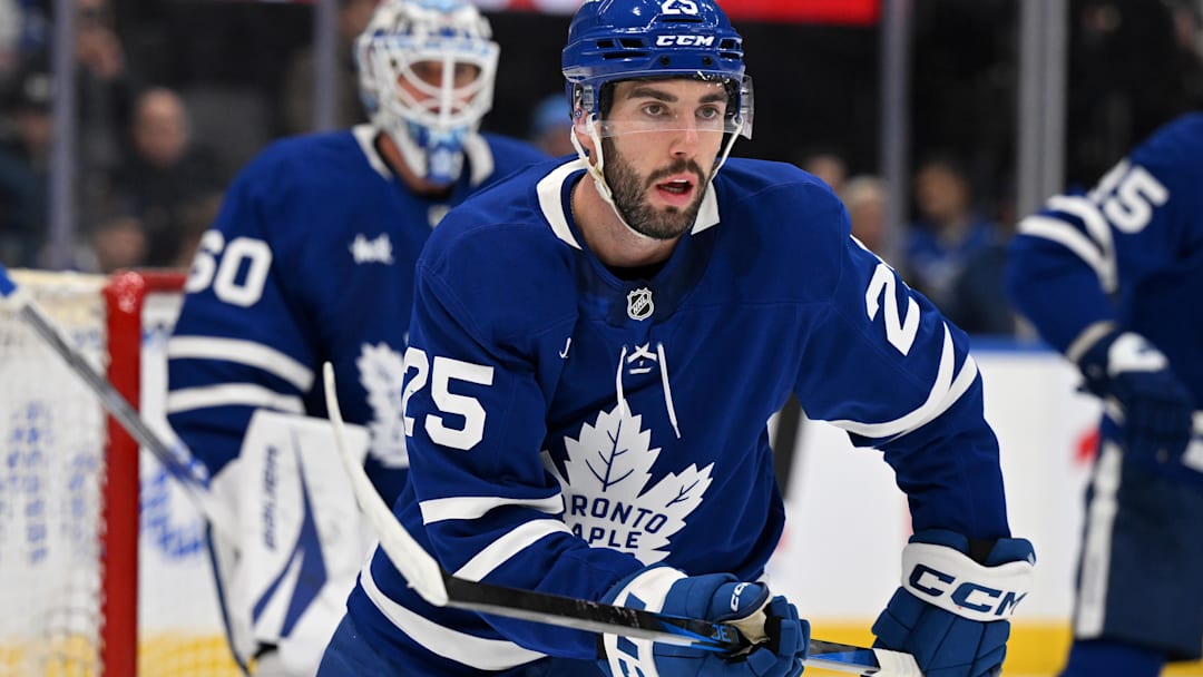 Dec 4, 2024; Toronto, Ontario, CAN;  Toronto Maple Leafs defenseman Conor Timmins (25) tracks the play against the Nashville Predators in the second period at Scotiabank Arena. Mandatory Credit: Dan Hamilton-Imagn Images