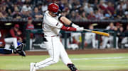 Apr 22, 2025; Phoenix, Arizona, USA; Tampa Bay Rays infielder Tim Tawa hits a solo home run in the fifth inning against the Arizona Diamondbacks at Chase Field. Mandatory Credit: Mark J. Rebilas-Imagn Images