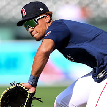 May 17, 2025; Boston, Massachusetts, USA; Boston Red Sox second baseman Kristian Campbell (28) fields the ball at first base during warmups before a game against the Atlanta Braves at Fenway Park. Mandatory Credit: Brian Fluharty-Imagn Images