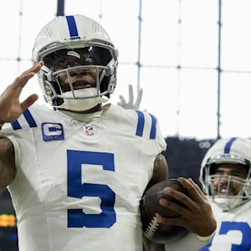 Indianapolis Colts quarterback Anthony Richardson (5) celebrates after rushing for a touchdown during a game against the Tennessee Titans at Lucas Oil Stadium.