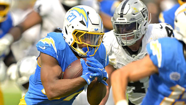 Chargers running back J.K. Dobbins runs the ball 