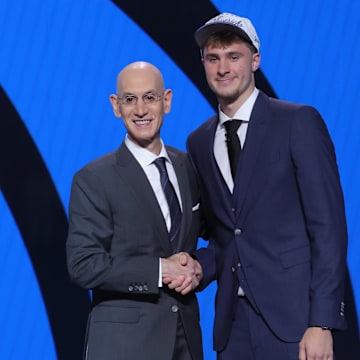 Cooper Flagg shakes hands with NBA commissioner Adam Silver after being selected No. 1 by the Mavericks.