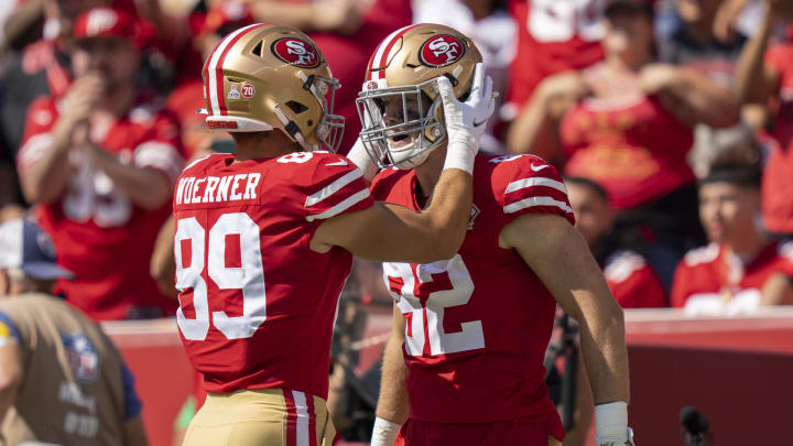 Now-Atlanta Falcons tight ends Ross Dwelley and Charlie Woerner celebrate as members of the San Francisco 49ers in 2021.