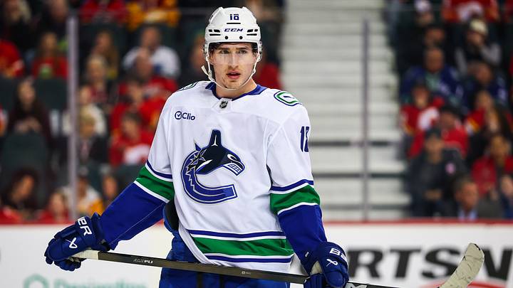Mar 28, 2026; Calgary, Alberta, CAN; Vancouver Canucks left wing Drew O'Connor (18) against the Calgary Flames during the first period at Scotiabank Saddledome. Mandatory Credit: Sergei Belski-Imagn Images