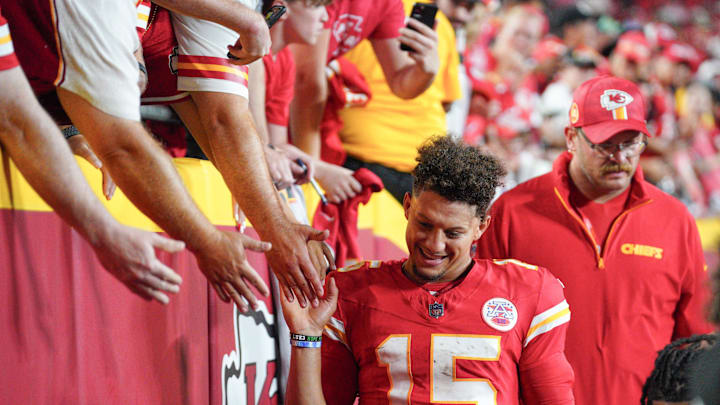 Sep 5, 2024; Kansas City, Missouri, USA; Kansas City Chiefs quarterback Patrick Mahomes (15) greets fans as he leaves the field after the win over the Baltimore Ravens at GEHA Field at Arrowhead Stadium. Mandatory Credit: Denny Medley-Imagn Images