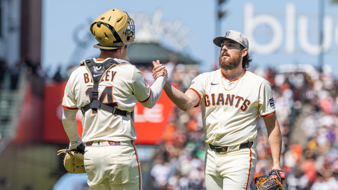 May 18, 2025; San Francisco, California, USA; San Francisco Giants pitcher Ryan Walker (74) and San Francisco Giants catcher Patrick Bailey (14) celebrate their victory against the Oakland Athletics at Oracle Park. Mandatory Credit: Bob Kupbens-Imagn Images