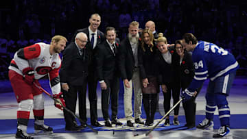 Nov 9, 2025; Toronto, Ontario, CAN; 2025 Hockey Hall of Fame inductees (left to right) Jack Parker, Zdeno Chara,  Duncan Keith, Joe Thornton, Jennifer Botteril, Brianna Decker, and  Daniele Sauvageau drop the puck to Carolina Hurricanes forward Jordan Staal (11) and Toronto Maple Leafs forward Auston Matthews (34) before the start of the game at Scotiabank Arena. Mandatory Credit: John E. Sokolowski-Imagn Images