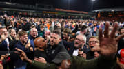 Luton manager Rob Edwards is swarmed by a pitch invasion