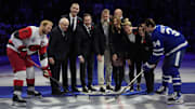 Nov 9, 2025; Toronto, Ontario, CAN; 2025 Hockey Hall of Fame inductees (left to right) Jack Parker, Zdeno Chara,  Duncan Keith, Joe Thornton, Jennifer Botteril, Brianna Decker, and  Daniele Sauvageau drop the puck to Carolina Hurricanes forward Jordan Staal (11) and Toronto Maple Leafs forward Auston Matthews (34) before the start of the game at Scotiabank Arena. 