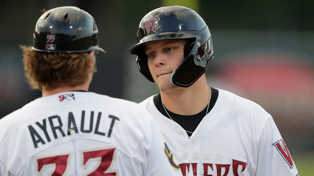 Wisconsin Timber Rattlers    Brock Wilken (25) talks with manager Joe Ayrault after reaching first base against the Dayton Dragons Tuesday, August 8, 2023, at Neuroscience Group Field at Fox Cities Stadium in Grand Chute, Wis.Dan Powers/USA TODAY NETWORK-Wisconsin.