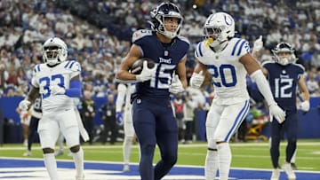 Dec 22, 2024; Indianapolis, Indiana, USA; Tennessee Titans wide receiver Nick Westbrook-Ikhine (15) scores a touchdown 4, during a game against the Indianapolis Colts at Lucas Oil Stadium. Mandatory Credit: Christine Tannous/USA Today Network via Imagn Images 