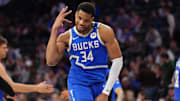 Bucks forward Giannis Antetokounmpo reacts after a play against the 76ers.