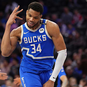Bucks forward Giannis Antetokounmpo reacts after a play against the 76ers.