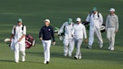 Apr 10, 2025; Augusta, Georgia, USA; Cameron Smith, Aaron Rai and J.T. Poston walk the no. 2 fairway during the first round of the Masters Tournament. Mandatory Credit: Michael Madrid-Imagn Images