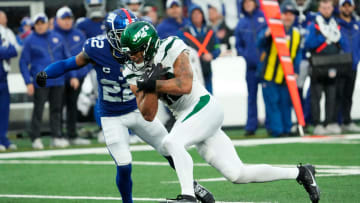 October 29, 2023; East Rutherford, NJ, USA; New York Jets wide receiver Allen Lazard (10) runs with the ball before being stopped by New York Giants cornerback Adoree' Jackson (22) in the fourth quarter.