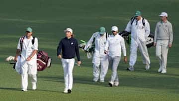 Apr 10, 2025; Augusta, Georgia, USA; Cameron Smith, Aaron Rai and J.T. Poston walk the no. 2 fairway during the first round of the Masters Tournament. Mandatory Credit: Michael Madrid-Imagn Images