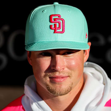 San Diego Padres pitcher Mason Miller (22) looks on from the dugout before the game against the St. Louis Cardinals at Petco Park on Friday.