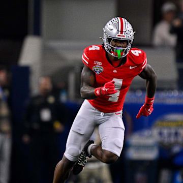 Jan 10, 2025; Arlington, TX, USA; Ohio State Buckeyes wide receiver Jeremiah Smith (4) in action during the game between the Texas Longhorns and the Ohio State Buckeyes at AT&T Stadium. Mandatory Credit: Jerome Miron-Imagn Images