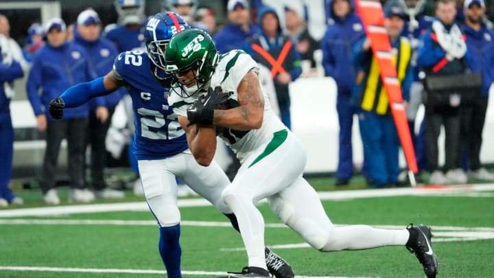 October 29, 2023; East Rutherford, NJ, USA; New York Jets wide receiver Allen Lazard (10) runs with the ball before being stopped by New York Giants cornerback Adoree' Jackson (22) in the fourth quarter.