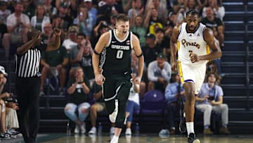 Nov 25, 2025; Fort Myers, Florida, USA; Michigan State Spartans forward Jaxon Kohler (0) reacts after a basket against the East Carolina Pirates in the first half at Suncoast Credit Union Arena. Mandatory Credit: Nathan Ray Seebeck-Imagn Images