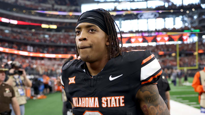 Oklahoma State's Ollie Gordon II (0) walks of the field following the Big 12 Football Championship game between the Oklahoma State University Cowboys and the Texas Longhorns at the AT&T Stadium in Arlington, Texas, Saturday, Dec. 2, 2023.