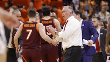 Feb 1, 2025; Charlottesville, Virginia, USA; Virginia Tech Hokies head coach Mike Young (center) reacts with players during a stoppage in play on the court against the Virginia Cavaliers in the second half at John Paul Jones Arena. Mandatory Credit: Amber Searls-Imagn Images