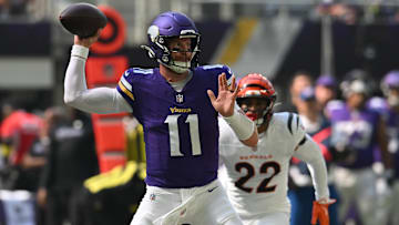 Sep 21, 2025; Minneapolis, Minnesota, USA; Minnesota Vikings quarterback Carson Wentz (11) throws downfield against the Cincinnati Bengals during the first half at U.S. Bank Stadium. Mandatory Credit: Jeffrey Becker-Imagn Images