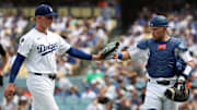 Sep 21, 2025; Los Angeles, California, USA;  Los Angeles Dodgers starting pitcher Emmet Sheehan (80) is greeted by catcher Dalton Rushing (68) during the seventh inning against the San Francisco Giants at Dodger Stadium. Mandatory Credit: Kiyoshi Mio-Imagn Images