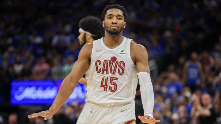 Apr 27, 2024; Orlando, Florida, USA; Cleveland Cavaliers guard Donovan Mitchell (45) reacts after making a there point basket against the Orlando Magic in the second quarter during game four of the first round for the 2024 NBA playoffs at Kia Center. Mandatory Credit: Nathan Ray Seebeck-USA TODAY Sports