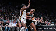 Jul 16, 2025; Brooklyn, New York, USA; New York Liberty center Nyara Sabally (8) drives to the basket while defended by Indiana Fever forward Aliyah Boston (7) during the first half at Barclays Center. Mandatory Credit: John Jones-Imagn Images